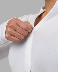 Woman wearing AeroFLX+ Long Sleeve Half Zip - White/White | Model:Hannah | Size:S