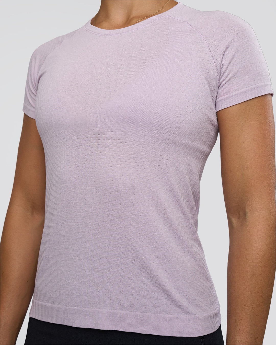 Woman wearing AeroFLX+ Seamless Tee - Fair Orchid/Fair Orchid | Model:Abbey | Size:S