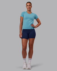 Woman wearing AeroFLX+ Seamless Tee - Retro Blue Marl | Model:Charlize | Size:S | Thumbnail Index: 1