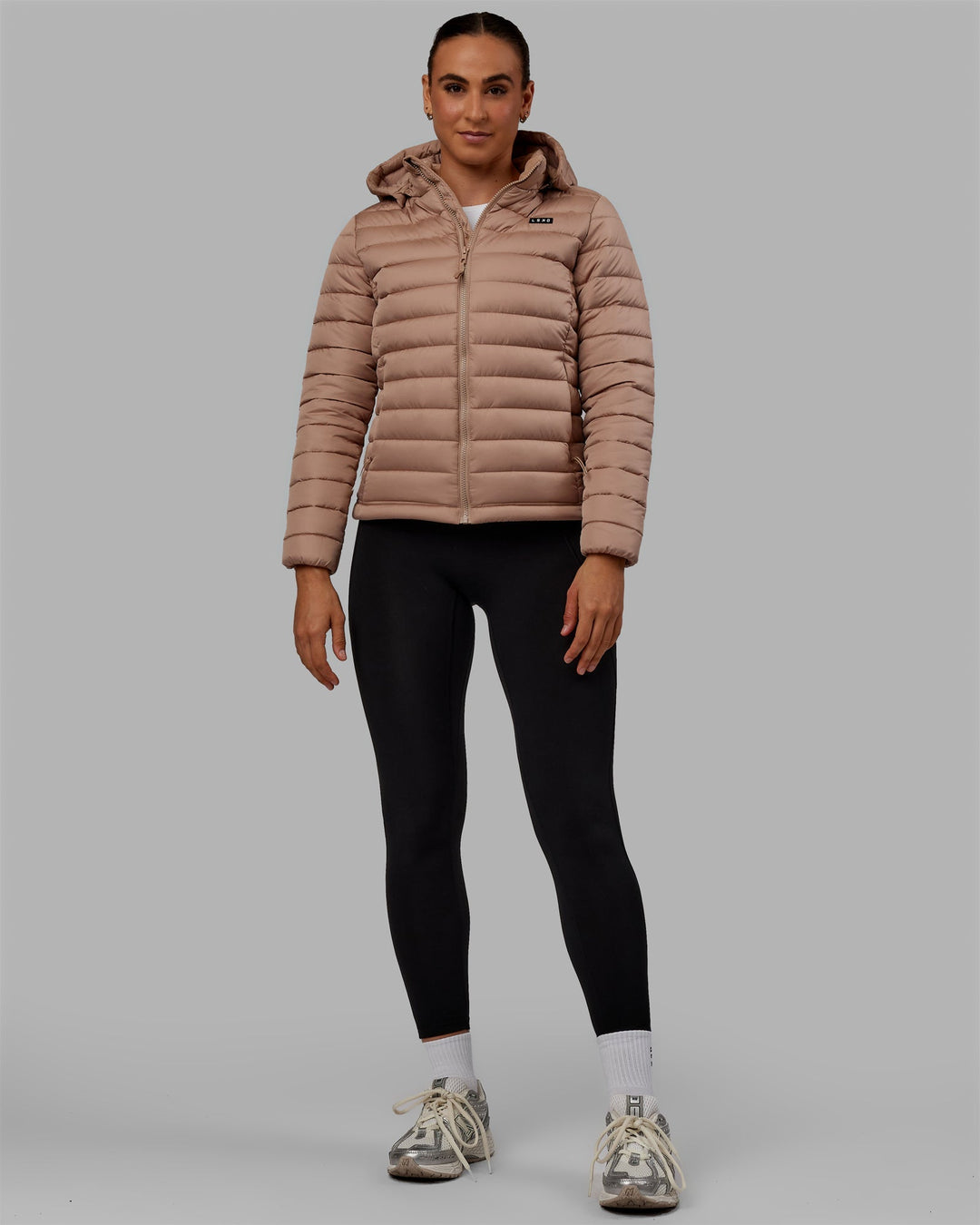 Woman wearing All Day Puffer Jacket - Desert