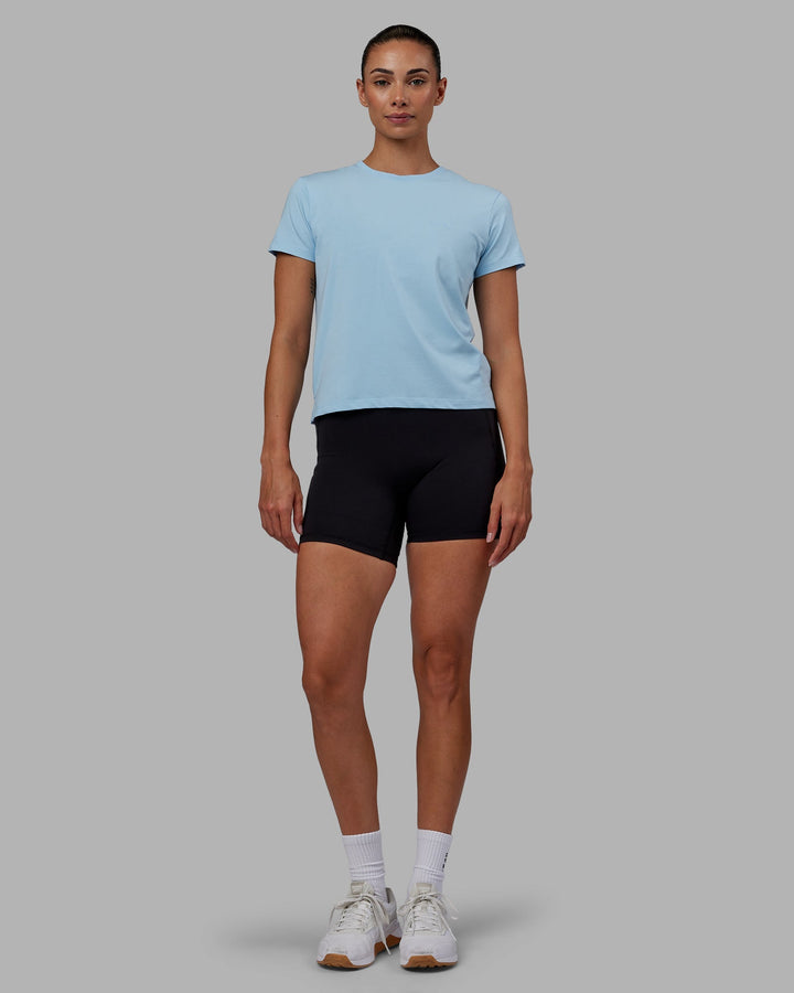 Woman wearing Deluxe PimaFLX Tee - Glacial Blue
