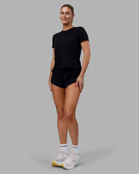 Woman wearing Pace Running Tee - Black | Model:Hannah | Size:S