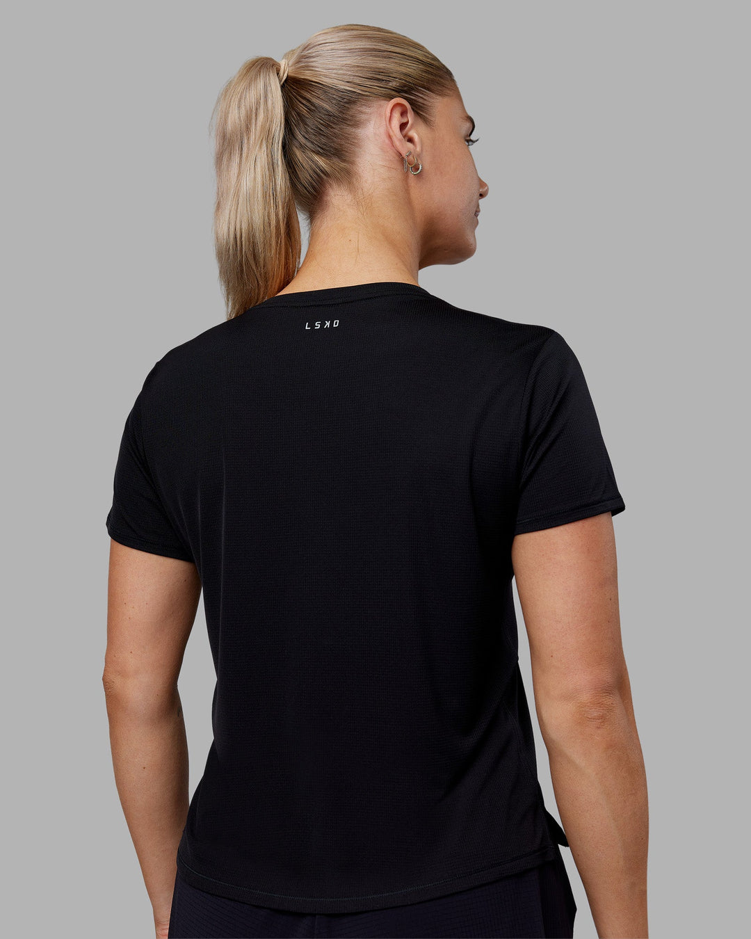 Woman wearing Pace Running Tee - Black | Model:Hannah | Size:S