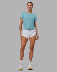 Woman wearing Pace Running Tee - Retro Blue | Model:Hannah | Size:S | Thumbnail Index: 0