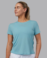 Woman wearing Pace Running Tee - Retro Blue | Model:Hannah | Size:S | Thumbnail Index: 1