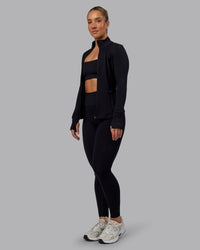 Woman wearing Stride Zip Through Jacket in Black | Size:S
