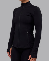 Woman wearing Stride Zip Through Jacket in Black | Size:S