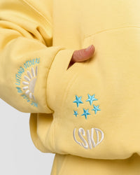 Woman wearing Zola Oversized Hoodie - Lemon | Model:Issy | Size:S
