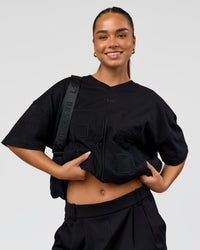Woman wearing 86 V-Neck Oversized Tee - Black-Black | Model:Sophia | Size:S 
