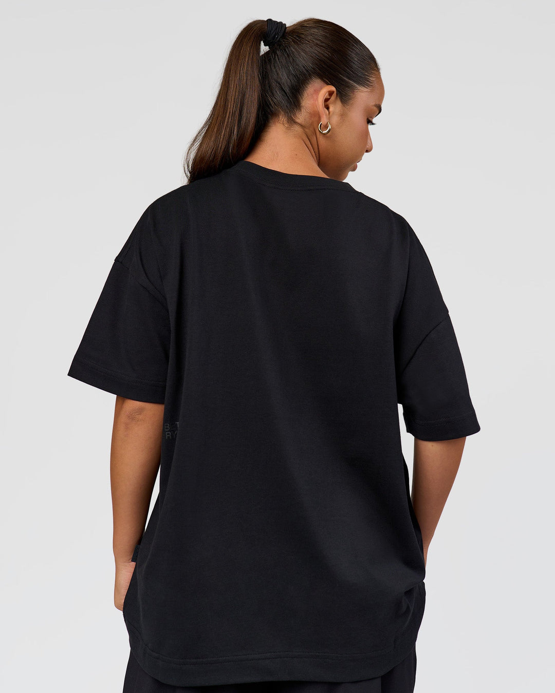 Woman wearing 86 V-Neck Oversized Tee - Black-Black | Model:Sophia | Size:S |