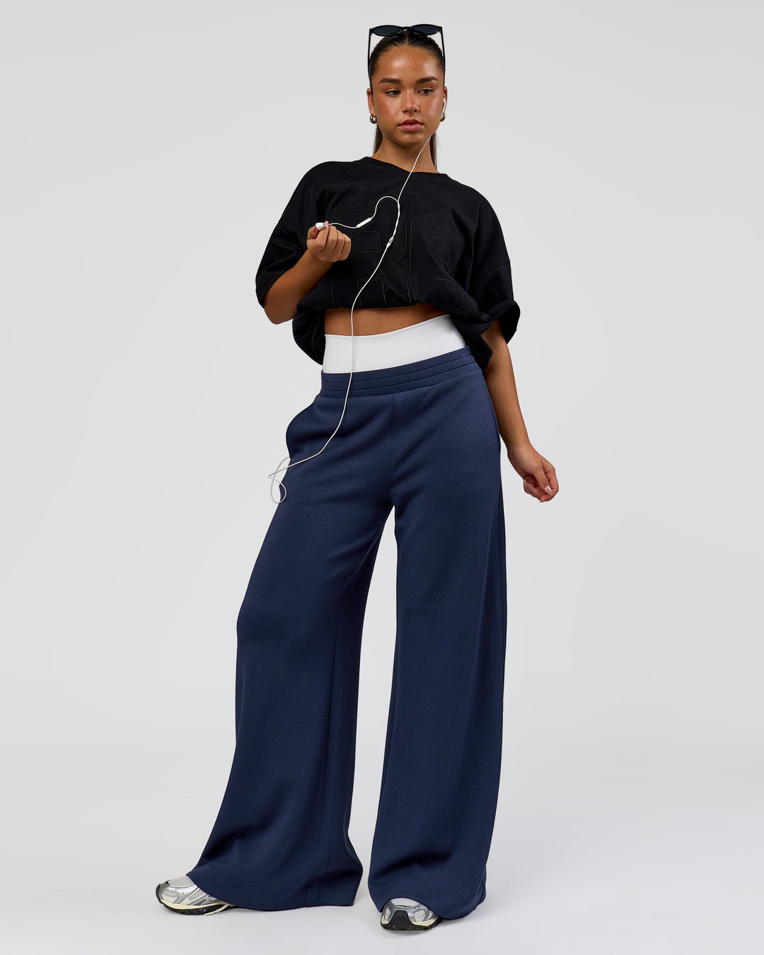 Woman wearing 86 V-Neck Oversized Tee - Black-Black | Model:Sophia | Size:S |