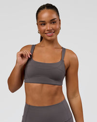 Woman wearing Inertia Sports Bra - Duskstone | Model:Rosie | Size:S | Thumbnail Index: 0