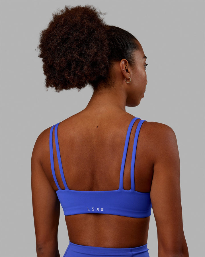 Woman wearing Vogue Sports Bra - Power Cobalt
