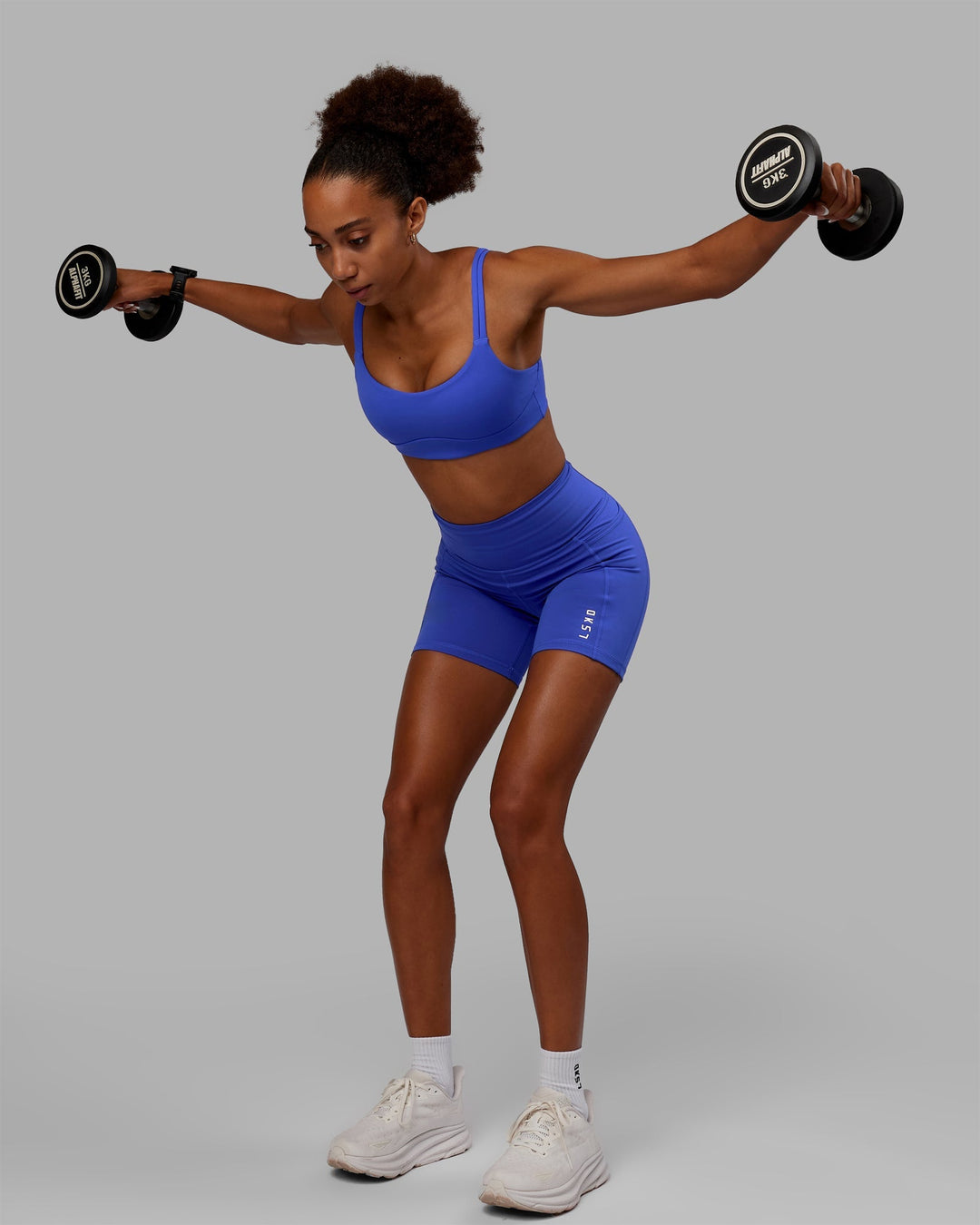 Woman wearing Vogue Sports Bra - Power Cobalt