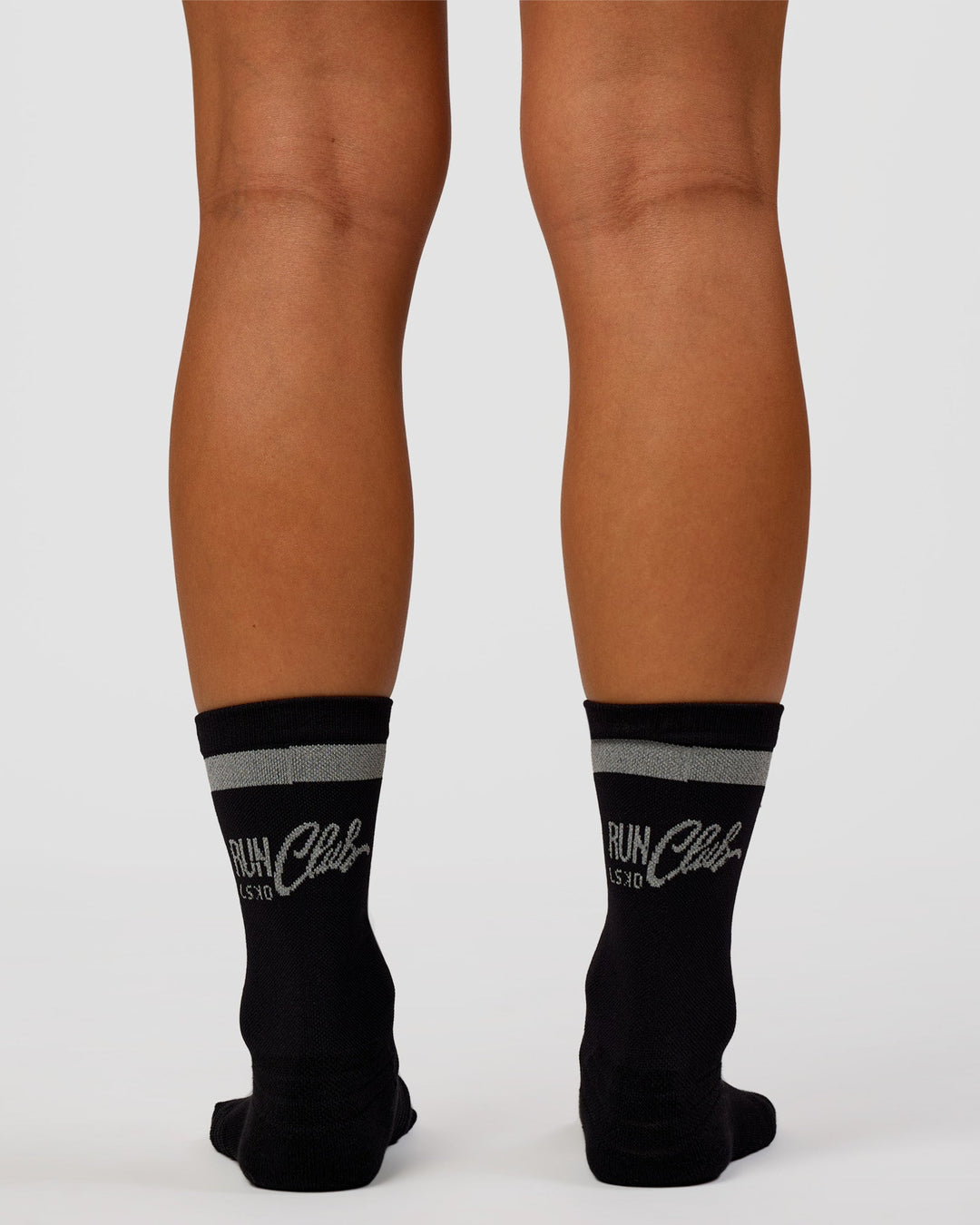 Woman wearing Run Club Fast Performance Socks 2.0 - Black-Reflective