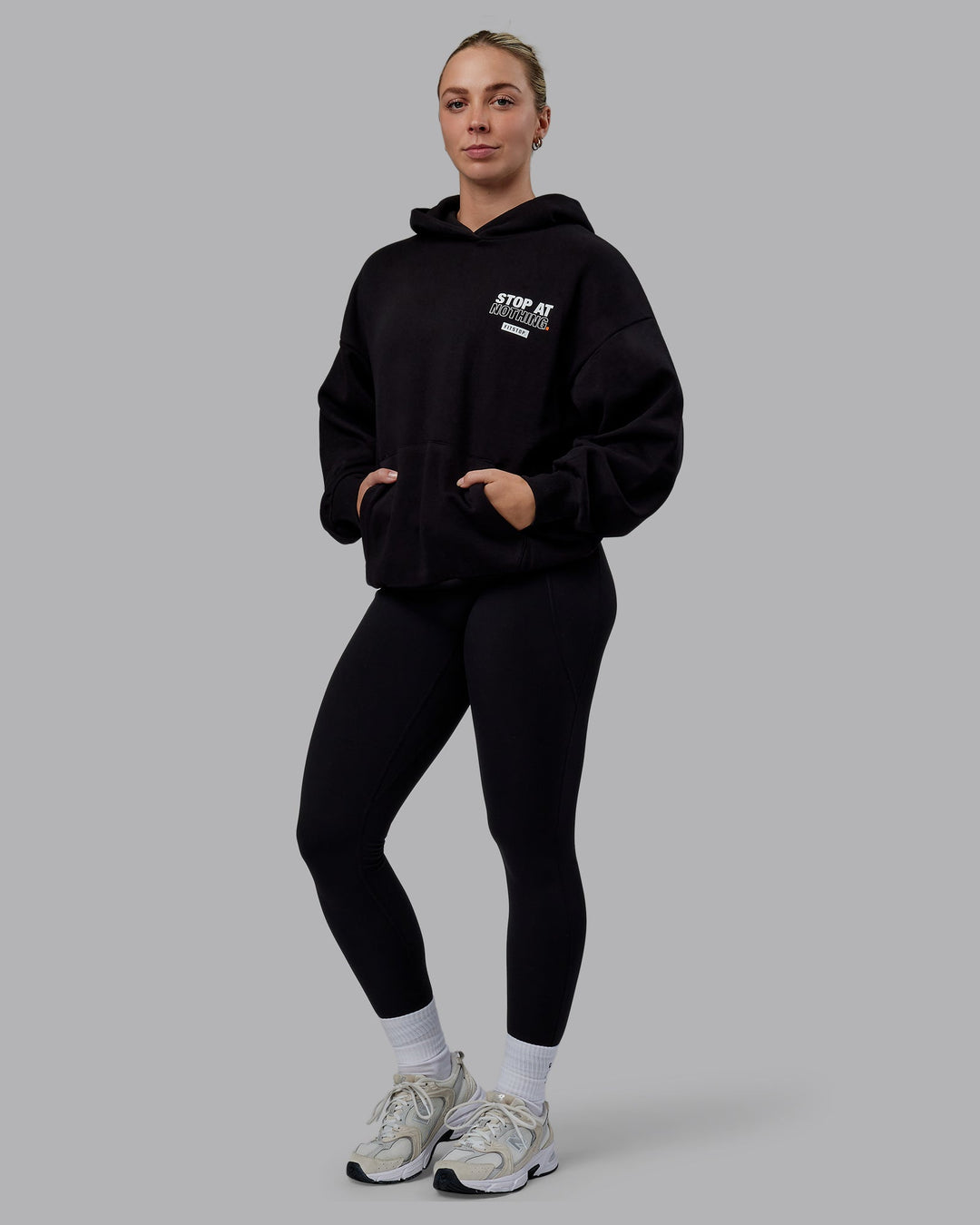 Woman wearing Unisex Fitstop Stop at Nothing Hoodie Oversize - Black