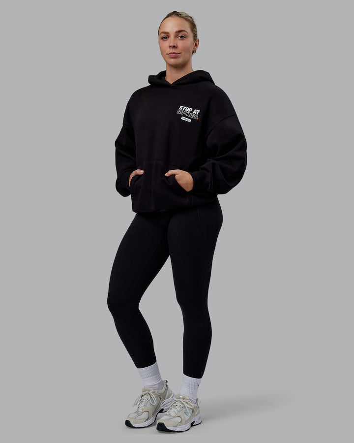 Woman wearing Unisex Fitstop Stop at Nothing Hoodie Oversize - Black
