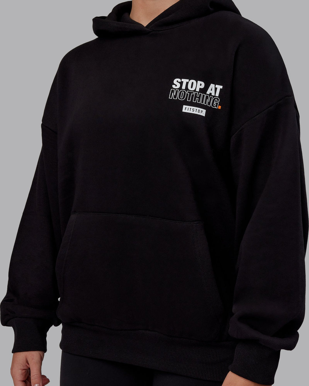 Woman wearing Unisex Fitstop Stop at Nothing Hoodie Oversize - Black