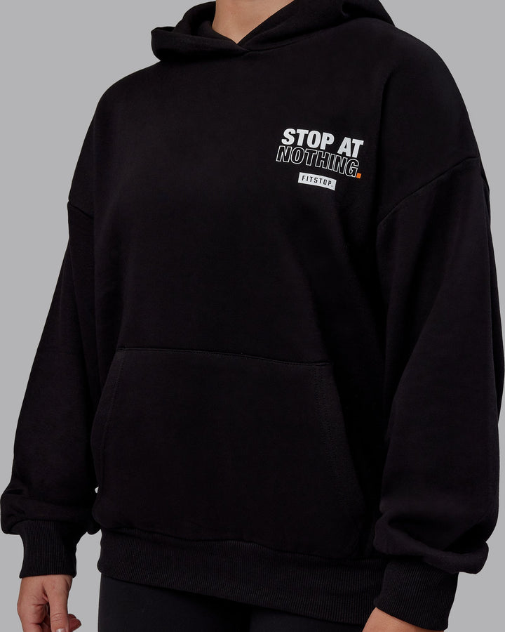 Woman wearing Unisex Fitstop Stop at Nothing Hoodie Oversize - Black
