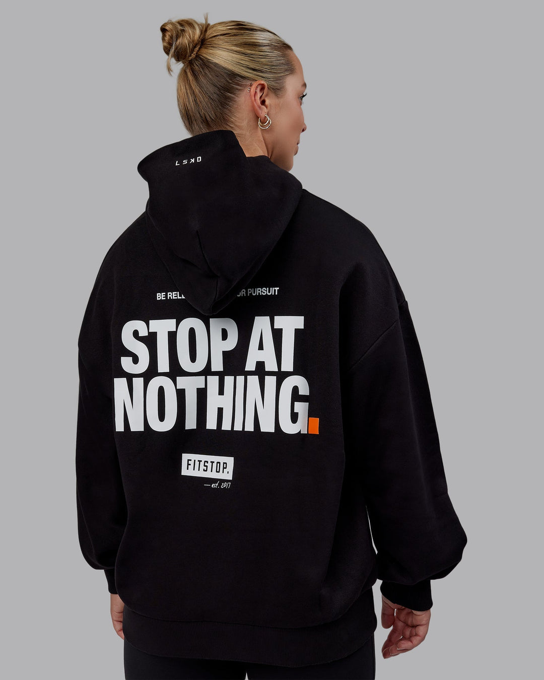 Woman wearing Unisex Fitstop Stop at Nothing Hoodie Oversize - Black