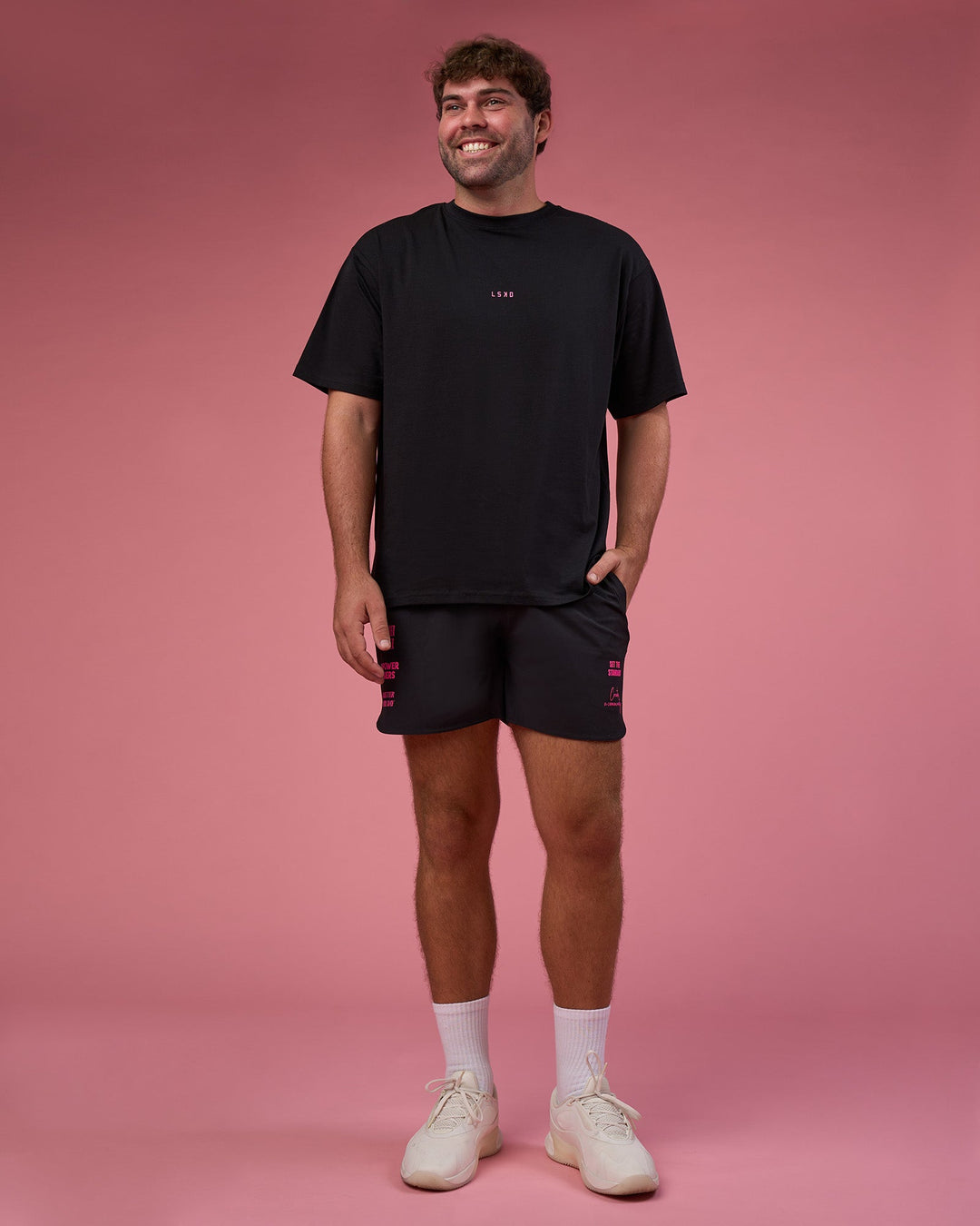Man wearing BCAM FLXCotton Oversized Tee - Black-Ultra Pink | Model:Fletcher | Size:XL