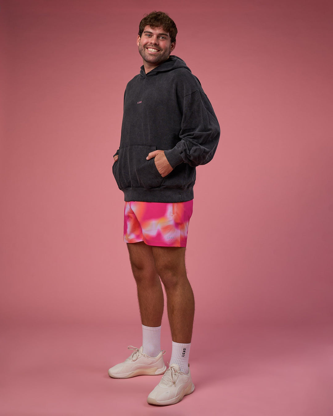 Man wearing BCAM Washed Unisex Oversized Hoodie - Black Washed-Pink | Model:Fletcher | Size:XL