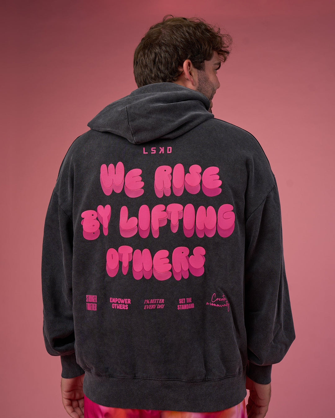 Man wearing BCAM Washed Unisex Oversized Hoodie - Black Washed-Pink | Model:Fletcher | Size:XL