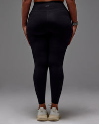 Woman wearing Fusion Ultra High-Rise Full Length Legging Pockets - Black | Model:Aimee | Size:XL