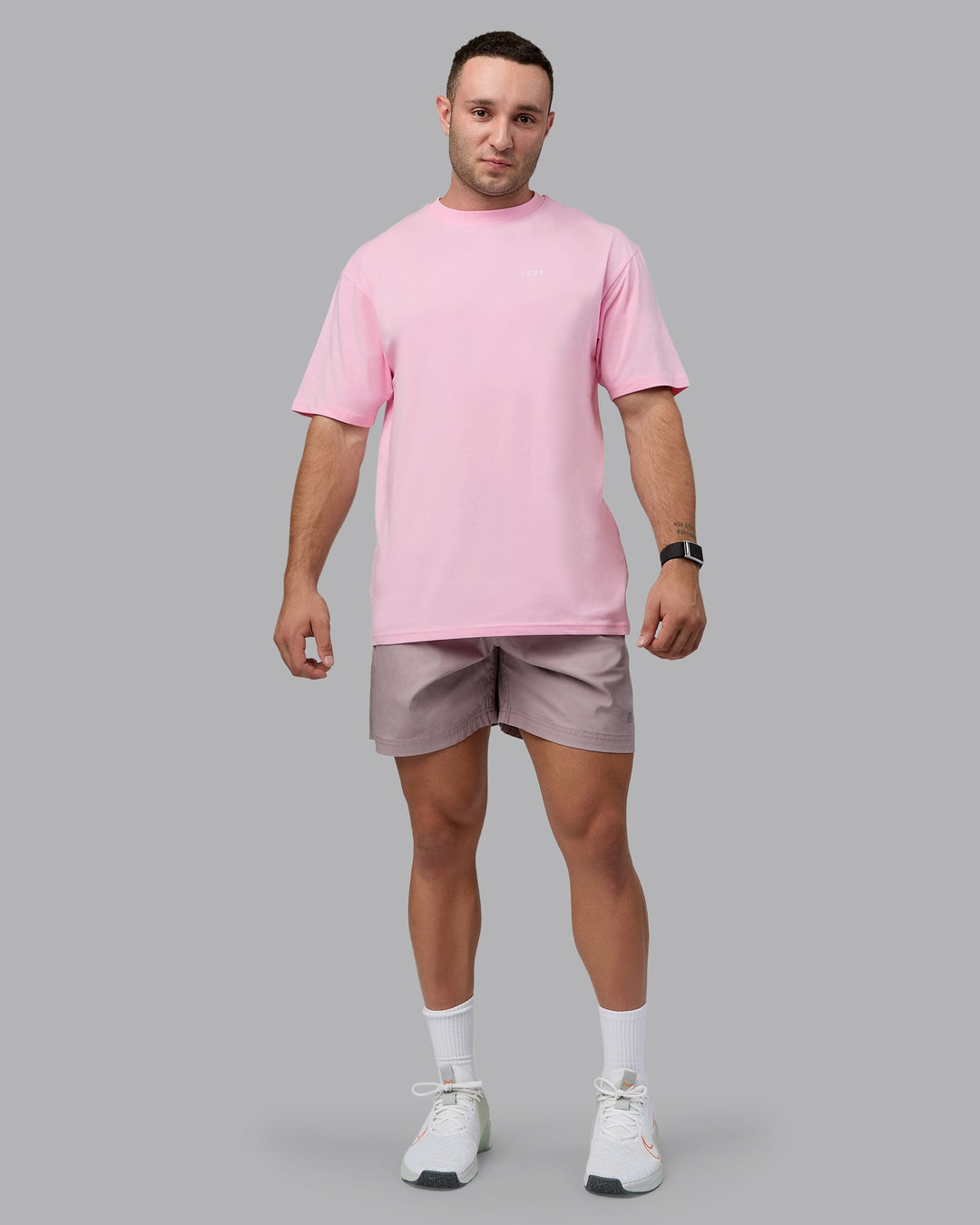 Man wearing Unisex 1% Better Value Series FLXCotton Tee Oversize - Pale Pink-White