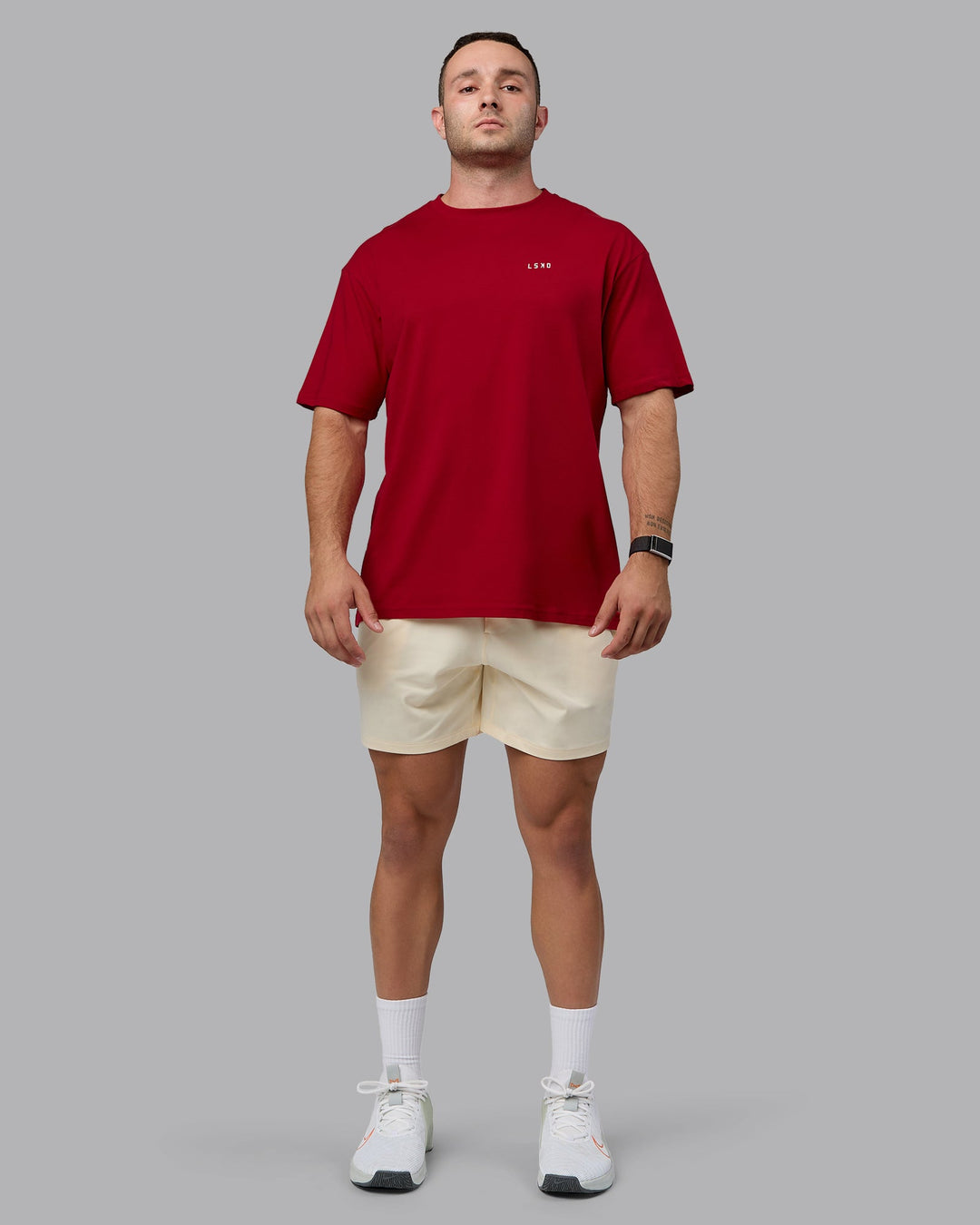 Man wearing Unisex Enjoy the Journey Value Series FLXCotton Tee Oversize - Cherry Red-Ivory