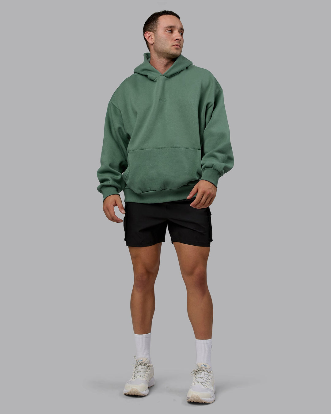 Man wearing Unisex MVP Hoodie Oversize - Sage Brush