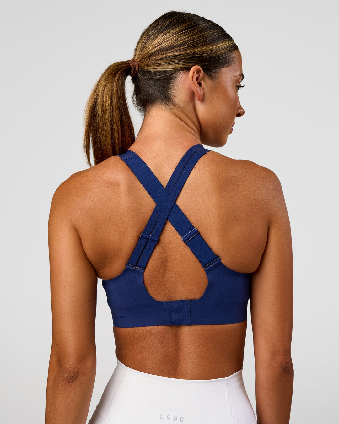 Woman wearing Stability High Support Sports Bra - Midnight Blue | Model:Charli | Size:XS (A-C Cup) - view 5
