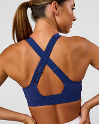 Woman wearing Stability High Support Sports Bra - Midnight Blue | Model:Charli | Size:XS (A-C Cup) | Thumbnail Index: 1