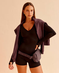 Woman wearing Vitality Long Sleeve Bodysuit - Black | Model:Brylee | Size:XS