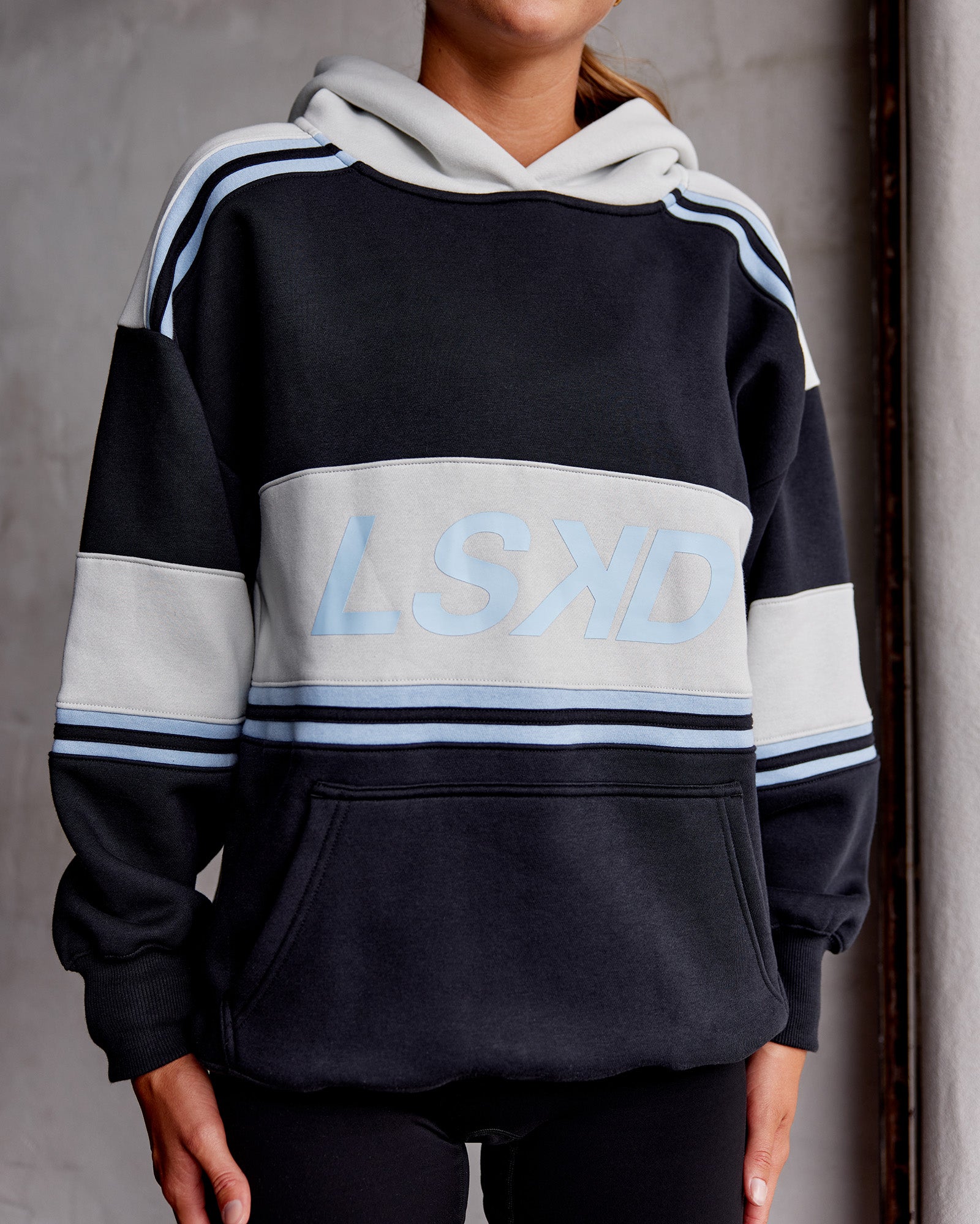 Woman wearing A-Team Oversized Hoodie - Caviar-Open Air | Model:Asia | Size:XS