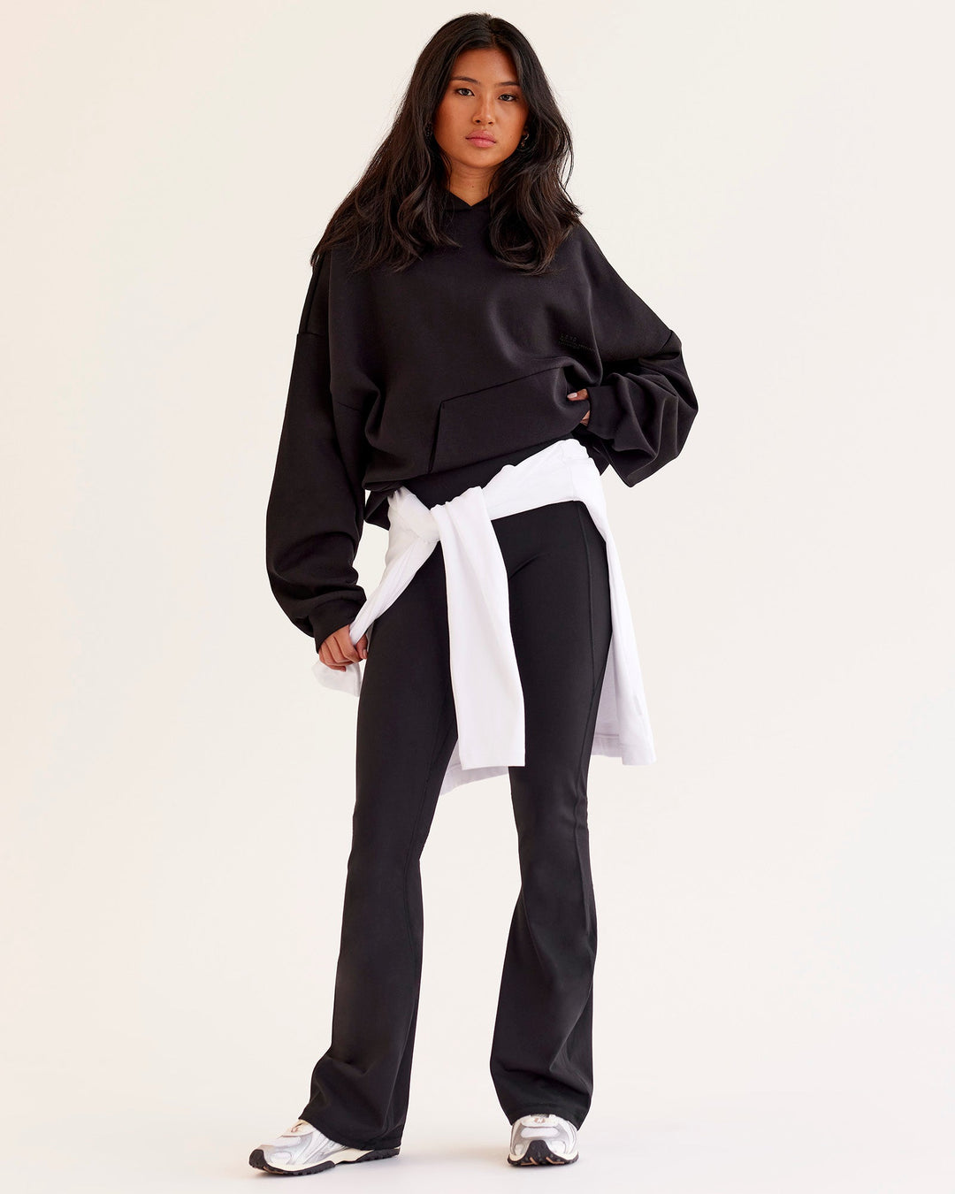 Woman wearing AfterDark ZeroCrease Oversized Hoodie - Black | Model:Loren | Size:XS