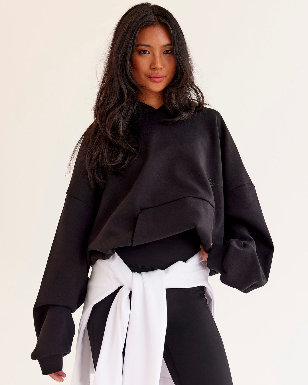 Woman wearing AfterDark ZeroCrease Oversized Hoodie - Black | Model:Loren | Size:XS