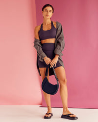 Woman wearing Aspire Sports Bra - Midnight Plum | Model:Bruna | Size:XS