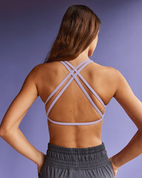 Woman wearing Aspire Twist Sports Bra - Pale Lilac | Model:Beatriz | Size:XS | Thumbnail Index: 4