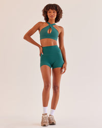 Woman wearing Bend & FLX Plunge Sports Bra - Transformative Teal | Model:Tomi | Size:XS