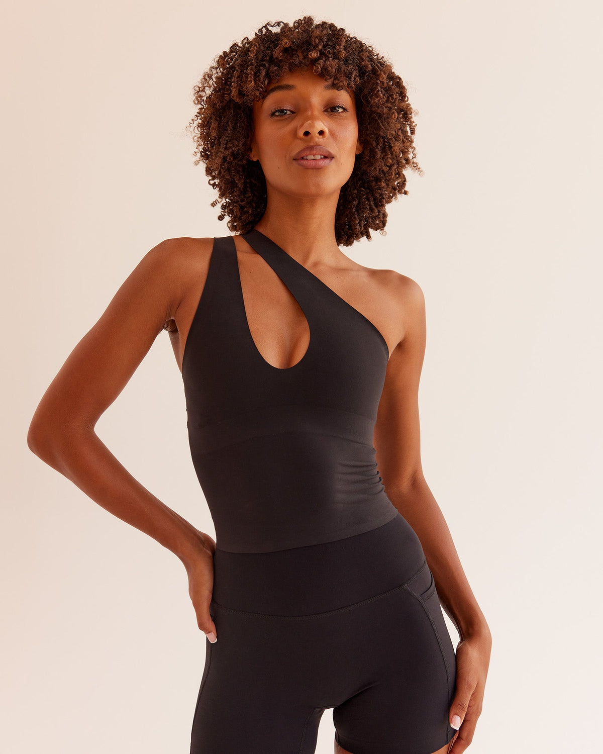 Woman wearing Bend & FLX Plunge Tank - Black | Model:Tomi | Size:XS - view 1