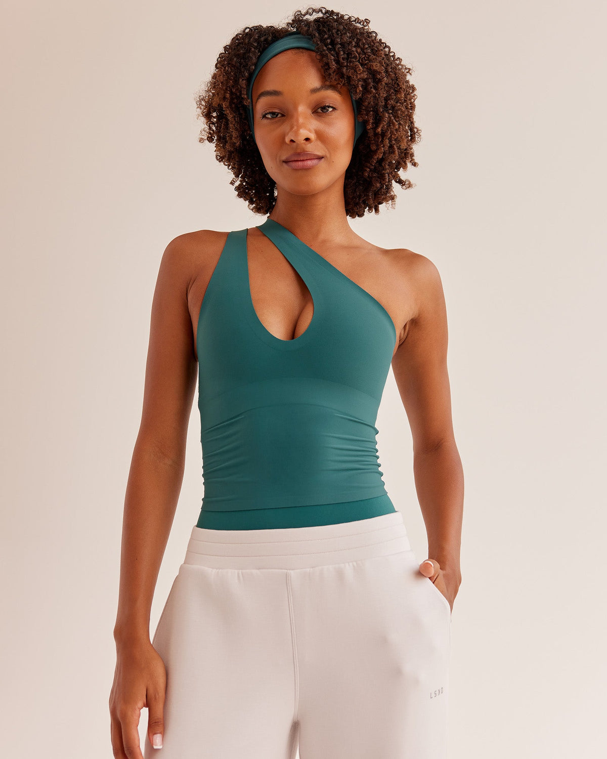 Woman wearing Bend & FLX Plunge Tank - Transformative Teal | Model:Tomi | Size:XS - view 2