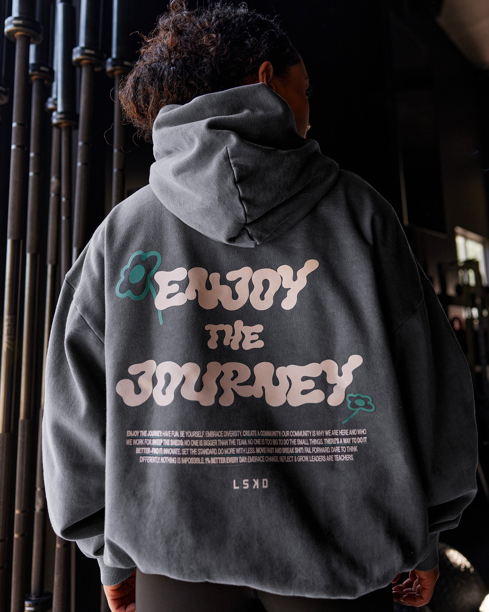 Woman wearing ETJ Values Washed Unisex Oversize Hoodie - Dark Storm-Light Bubblegum | Model:Tarnie | Size:Xs