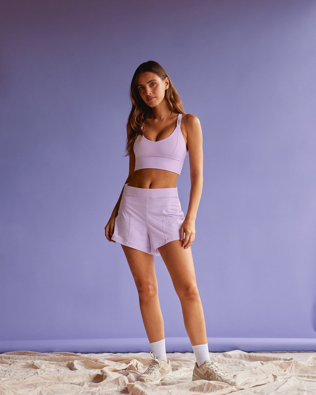 Woman wearing Flash Longline Sports Bra - Pale Lilac | Model:Beatriz | Size:XS