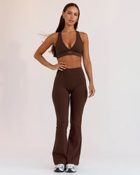 Woman wearing Fusion V-Contour High-Rise Flared Petite Legging Pockets - Hot Chocolate | Model:Brylee | Size:XS