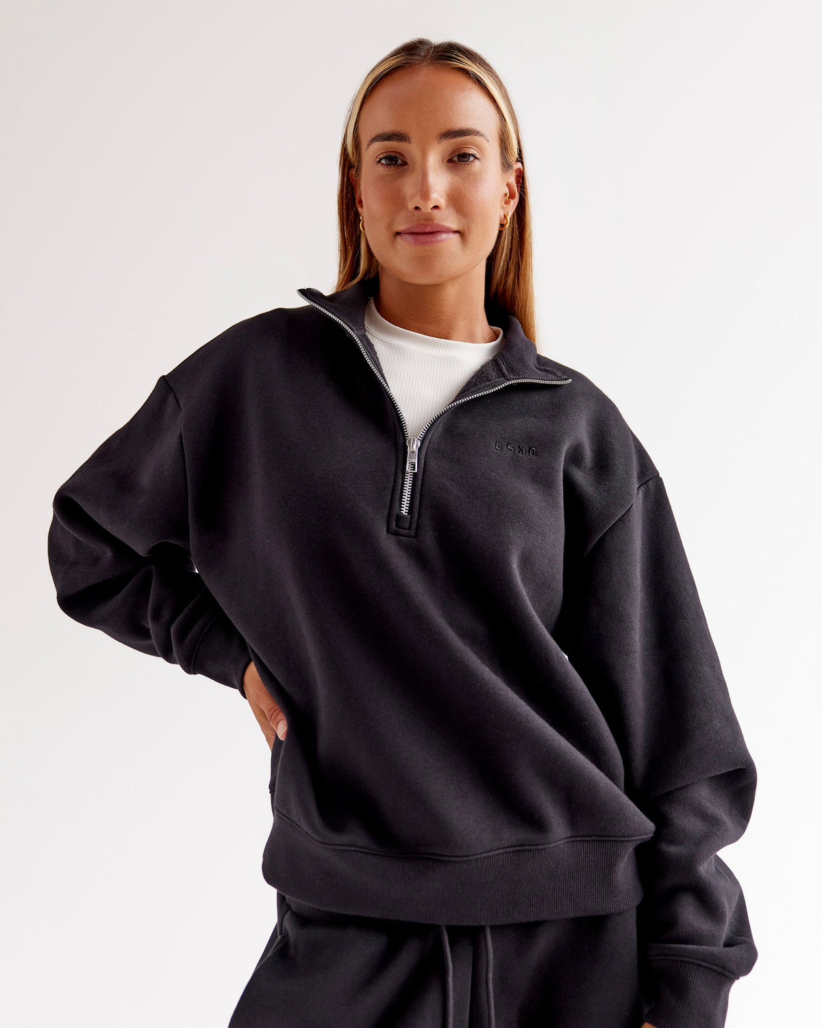 Woman wearing Go-To Oversized Quarter Zip Sweater - Black | Model:Jaimee | Size:XS