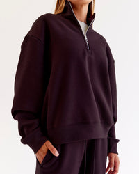 Woman wearing Go-To Oversized Quarter Zip Sweater - Midnight Plum | Model:Jaimee | Size:XS | Thumbnail Index: 0