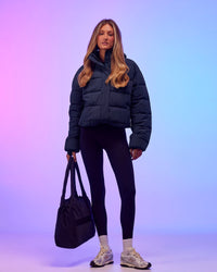 Woman wearing Go-To Puffer Jacket - Future Navy | Model:Georgia | Size:XS | Thumbnail Index: 1