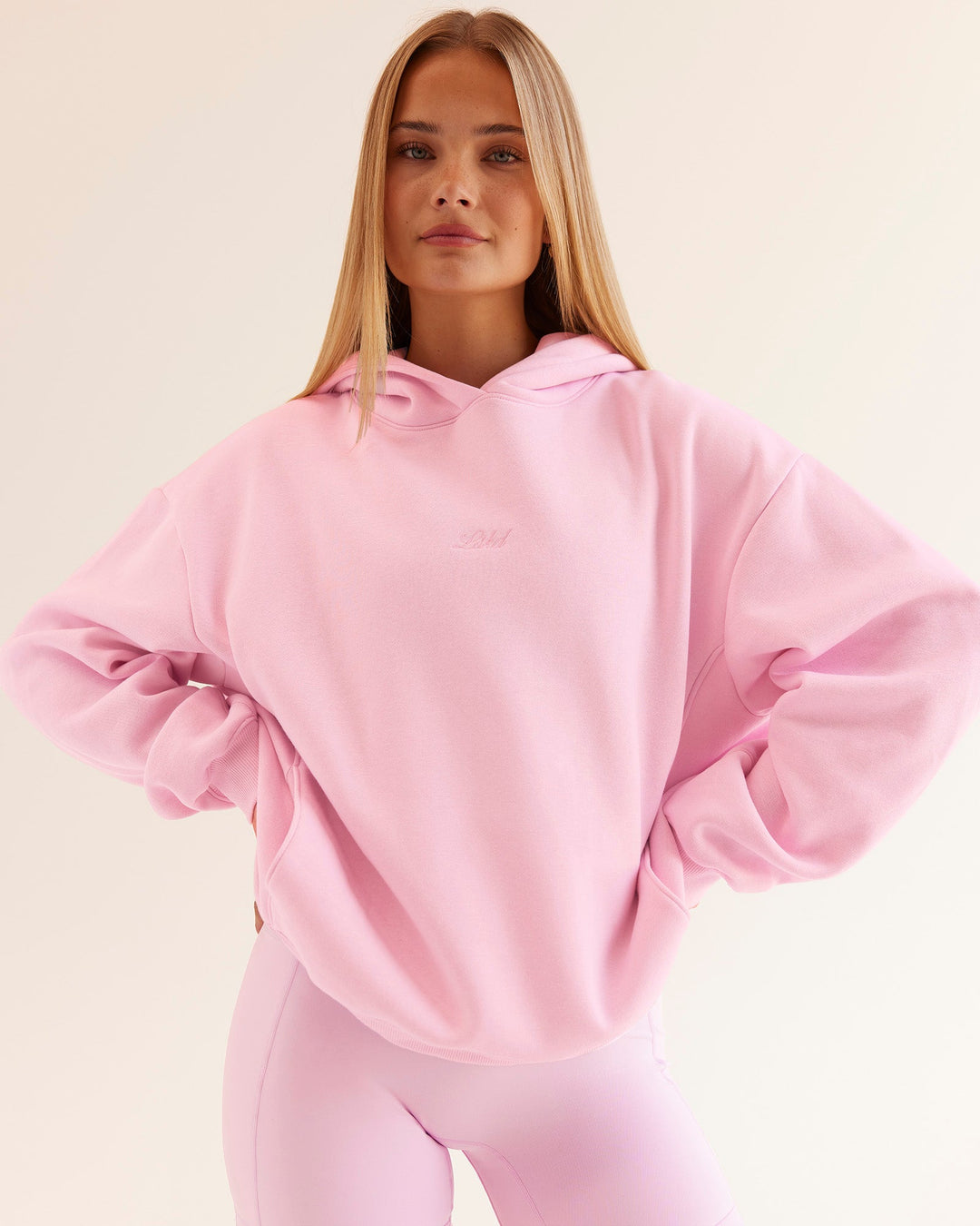 Woman wearing Go-To Script Oversized Hoodie - Marshmallow | Model:Taneisha | Size:XS
