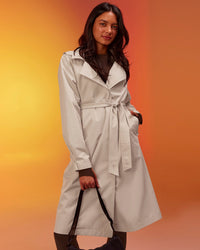 Woman wearing On the Move Trench Coat - Shale Beige | Model:Alex | Size:XS | Thumbnail Index: 1